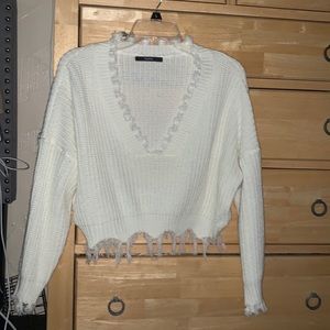 Distressed white cropped sweater